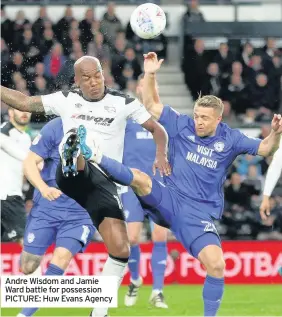  ??  ?? Andre Wisdom and Jamie Ward battle for possession PICTURE: Huw Evans Agency