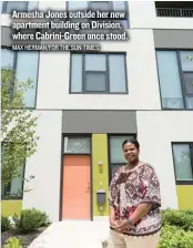  ?? MAX HERMAN/ FOR THE SUN- TIMES ?? Armesha Jones outside her new apartment building on Division, where Cabrini- Green once stood.