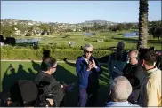  ?? GREGORY BULL — THE ASSOCIATED PRESS ?? Philadelph­ia Phillies president of baseball operations Dave Dombrowski, center right, talks with reporters during Major League Baseball’s general manager meetings Wednesday in Carlsbad, Calif.