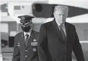  ?? SAULLOEB/GETTY-AFP ?? President Donald Trump walks toward Air Force One before departing Wednesday from Joint Base Andrews, Maryland, for his Mar-a-Lago resort in Florida where he and his family will spend the holidays.