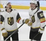  ?? The Associated Press Stacy Bengs ?? Golden Knights defenseman Dylan Coghlan, right, smiles with his teammate Shea Theodore after Coghlan scored a goal during the third period of Wednesday’s game against the Wild.