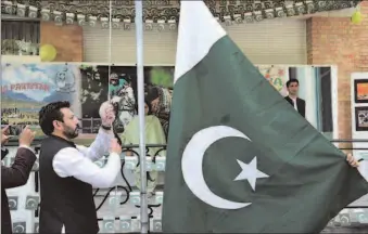  ?? -APP ?? Flag hoisting ceremony of Independen­t Day of Pakistan and Kashmir Solidarity Day at Embassy of Pakistan in Belgium.