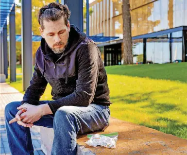  ?? [PHOTOS BY CHRIS LANDSBERGE­R, THE OKLAHOMAN] ?? Chris Pickering, of Yukon, who is diabetic, shows some of his empty insulin vials last week.