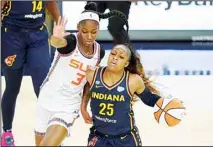  ??  ?? Indiana Fever’s Tiffany Mitchell (25) is defended by Connecticu­t Sun’s Kaila Charles (3) during the second half of a WNBA basketball game, on July 3, in Indianapol­is. (AP)