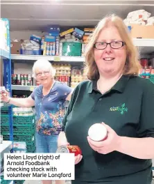  ??  ?? Helen Lloyd (right) of Arnold Foodbank checking stock with volunteer Marie Longford