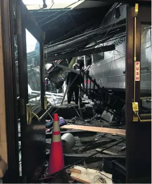  ?? Pancho Bernasconi / AFP ?? Devastatio­n after a commuter train ploughed through the barrier at the Hoboken terminal in New Jersey. At least one person was killed and 100 were injured.