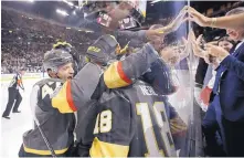  ?? JOHN LOCHER/ASSOCIATED PRESS ?? Golden Knights defenseman Luca Sbisa, left, celebrates with teammates after Vegas left wing James Neal (18) scored in the first period of the team’s home opener against Arizona on Tuesday night.