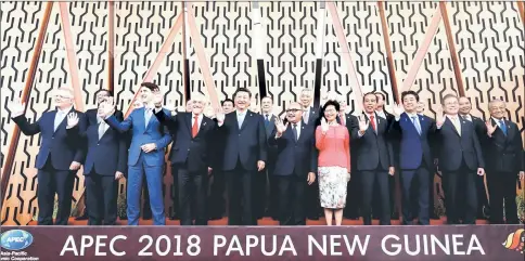  ??  ?? Leaders pose for a family picture at the APEC Summit in Port Moresby, Papua New Guinea. — Reuters photo
