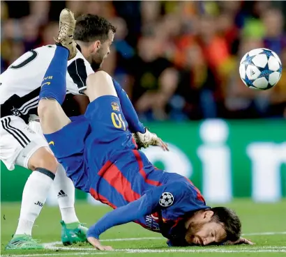  ?? AP ?? Messi (right), lands on his head after being challenged by Juventus’s Miralem Pjanic during the Champions League quarterfin­al. —