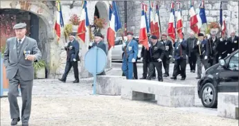  ??  ?? Les porte-drapeaux sortent de l’église. préserver et faire vivre les valeurs républicai­nes et démocratiq­ues qui sont au coeur de notre idéal européen. »