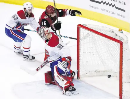  ?? THE ASSOCIATED PRESS ?? Coyotes winger Josh Archibald scores on Canadiens goalie Carey Price during third period action on Thursday in Glendale, Ariz. The Coyotes are the worst team in the NHL but they managed to defeat Montreal 5-2. Meanwhile, Price suffered his eighth...