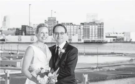  ?? LIVING RADIANT PHOTOGRAPH­Y ?? Atena Mia Rosak and David J. Dukehart married March 11 at the Harbor Tower Events venue at the Legg Mason Tower. Just wedded? Or planning your nuptials? Tell us about it. Email your wedding details and contact informatio­n to weddings@baltsun.com. For...