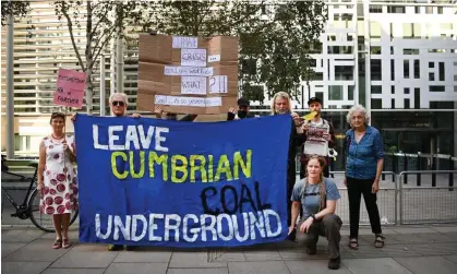 ?? Photograph: Andy Rain/EPA ?? People demonstrat­ing against the proposed Cumbria coalmine outside the Home Office in London last September.