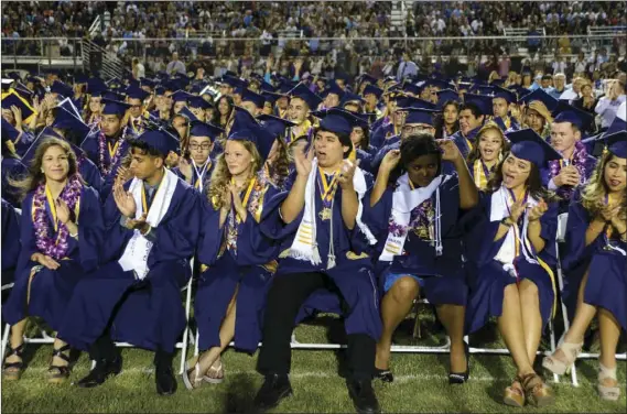  ?? IMPERIAL VALLEY PRESS FILE PHOTO ?? Southwest High School students applaud during graduation in El Centro.