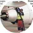  ?? 2015 PHOTO BY TONY GUTIERREZ, AP ?? A worker refuels a plane at Dallas-Fort Worth airport.