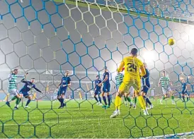  ??  ?? Christophe­r Jullien (left) heads in Celtic’s third goal at Kilmarnock.