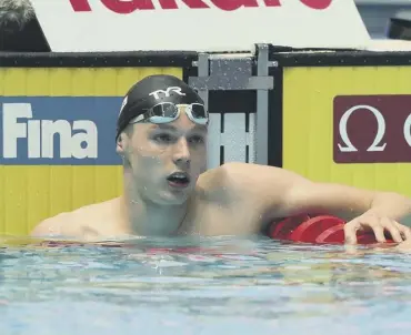  ??  ?? 0 Duncan Scott takes a breather after finishing second in yesterday’s 200m freestyle semi-final.