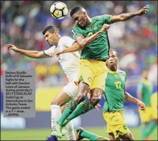  ??  ?? Nelson Bonilla (left) of El Salvador fights for the ball with Damion Lowe of Jamaica during yesterday’s 2017 CONCACAF Gold Cup at Alamodome in San Antonio,Texas. The game ended in a 1-1 draw. – AFPPIX