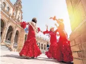  ?? ?? Flamenco dancers in Seville’s Plaza de Espana where up to 200,000 fans are arriving for the final