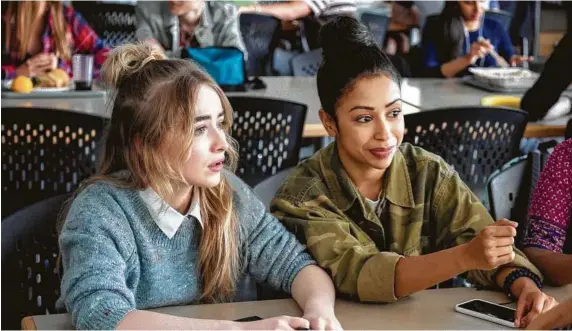  ?? Netflix ?? Koshy, right, and Sabrina Carpenter star in the Netflix film “Work It.”