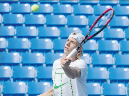  ?? PHOTOS: PAUL CHIASSON/THE CANADIAN PRESS ?? Denis Shapovalov returns a ball while training in Montreal on Thursday ahead of the U.S. Open.