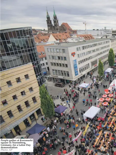  ??  ?? People gather at Kornmarkt square in Nuremberg, Germany, for a Labor Day demonstrat­ion Photo: AP