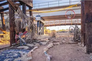  ?? ?? Tree limbs, different colored stones, bicycle rims and other objects were used to create the labyrinth.