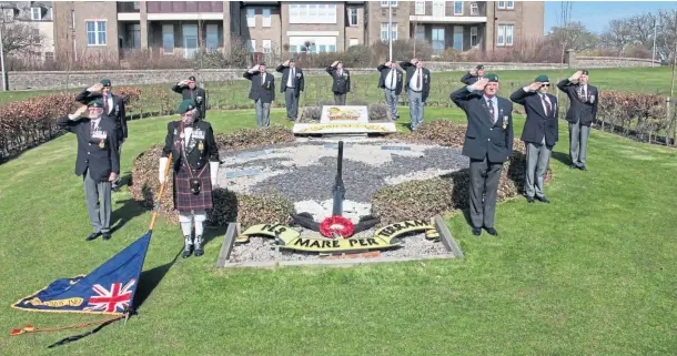  ??  ?? LAST RESPECTS: Members of East of Scotland Royal Marines Associatio­n laid a wreath and held a 15-minute silence in memory of Prince Philip.