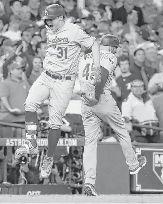  ?? Karen Warren / Houston Chronicle ?? Dodgers designated hitter Joc Pederson celebrates his three-run homer in the ninth inning off Joe Musgrove that effectivel­y sealed the Game 4 victory at Minute Maid Park.