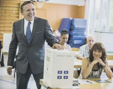  ?? PICTURE: GETTY IMAGES ?? 0 Coalition Avenir Québec founder François Legault votes in yesterday’s election