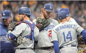  ?? MARK HOFFMAN / MILWAUKEE JOURNAL SENTINEL ?? Dodgers starting pitcher Clayton Kershaw is pulled in the fourth inning. He gave up four runs on six hits.