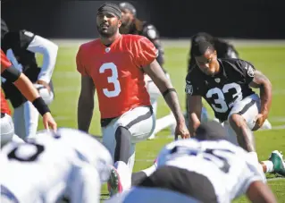  ?? Michael Macor / The Chronicle ?? Raiders quarterbac­k EJ Manuel (3) stretches before practice Wednesday. His job Sunday will be to stretch out the Raiders’ offense, which is in need of a spark, against Baltimore.