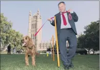  ?? PICTURE: DOMINIC LIPINSKI/PA WIRE ?? Shadow Employment Minister Mike Amesbury with Corbyn the cockapoo. DOG OF THE YEAR: