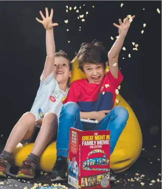  ?? Picture: JAY TOWN ?? Jarvis, 7, and Daniel, 9, enjoying a movie and popcorn.