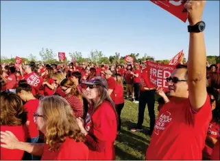  ?? PHOTO BY AMY CRAWFORD/YUMA SUN ?? Buy this photo at YumaSun.com YUMA COUNTY TEACHERS RALLY AT THE WEST WETLANDS PARK in Yuma, Ariz., about 5 p.m. Wednesday. Many teachers in Yuma have joined the statewide movement to see if the Legislatur­e will follow through with a pay raise...