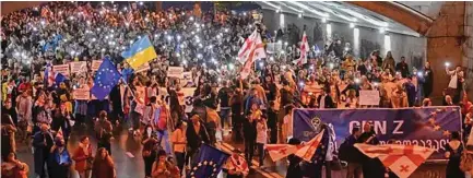  ?? Photo: BBC ?? Some estimates suggest as many as 50,000 Georgians braved the rain to march.