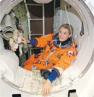  ?? NASA ?? Julie Payette participat­es in a training session in one of the full-scale trainers at NASA’s Johnson Space Center.