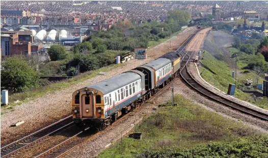  ?? MARTIN LOADER. ?? A Structure Gauging Train passes Narroways Hill Junction (Bristol) on April 16 1991, with Driving Trailer RDB975081 leading. This was formerly test coach Hermes and started life as Mk 1 BSK coach M35313. The rear coach, by the locomotive, is RDB975280, formerly test coach Mercury which housed the computer equipment and staff facilities. Between them is the structure gauging vehicle ZXQ DC460000. This oddlooking contraptio­n housed the optical gauging equipment. Providing the power at the rear on this occasion is 47974.