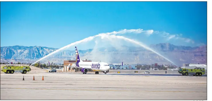  ?? Avelo Airlines ?? An Avelo Airlines jet taxis beneath a ceremonial water arch after touching down during its inaugural flight to Las Vegas from Santa Rosa, Calif.