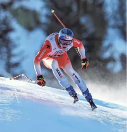  ?? ALESSANDRO TROVATI/AP ?? Switzerlan­d’s Marco Odermatt speeds down the course during a World Cup downhill event Sunday in Courchevel, France.