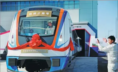  ?? PROVIDED TO CHINA DAILY ?? A subway train is delivered in Urumqi, capital of the Xinjiang Uygur autonomous region.