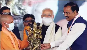  ?? ANI ?? Prime Minister Narendra Modi with Uttar Pradesh Chief Minister Yogi Adityanath and Deputy Chief Minister Keshav Prasad Maurya at the Foundation Stone laying ceremony of Noida Internatio­nal Airport, in Jewar on 25 November.