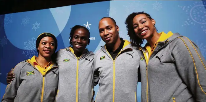  ?? (KER ROBERTSON/GETTY IMAGES) ?? L’équipe de glisse de Jamaïque lors de sa conférence de presse à Pyeongchan­g: de gauche à droite, Audra Segree, Carrie Russell, Anthony Watson et Jazmine Fenlator-Victorian.