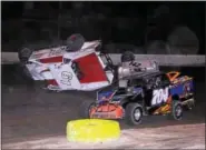  ?? SUBMITTED PHOTO - RICK KEPNER ?? Justin Grim (61) gets flipped next to Ryan Lilick (142) and Kory Flemming (704) during the Mods at the Madhouse on Oct. 16at Grandview Speedway.