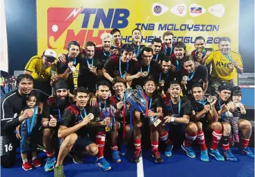  ??  ?? Time to celebrate: The KLHC team celebratin­g with the trophy after beating Terengganu 4-3 in penalty shootout in the final of the Tan Sri P. Alagendra Cup yesterday. — IZZRAFIQ ALIAS / The Star