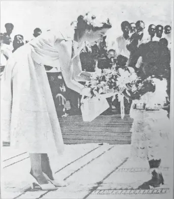  ?? Picture: FILE ?? Queen Elizabeth II is presented a bouquet of flowers which included the rare tagimoucia bloom from Taveuni from the four-year-old Adi Mei Kainona.