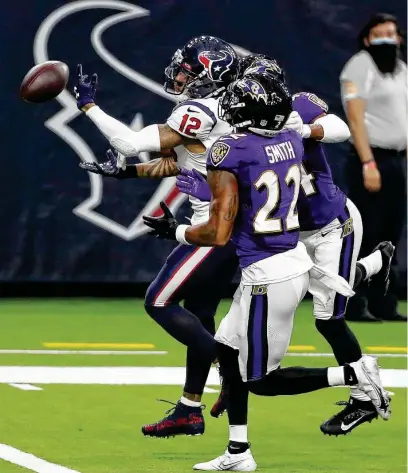  ?? Photos by Brett Coomer / Staff photograph­er ?? The Texans have been anything but sharp in their 0-2 start. Kenny Stills (12) sees this pass knocked away Sunday.