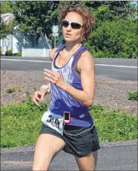  ?? JASON SIMMONDS/JOURNAL PIONEER ?? Stephanie Barry-Benedik of Stratford was the top female runner in the 40th anniversar­y of the Callbeck’s Home Hardware Dunk River Road Race in Bedeque on Sunday morning. Barry-Benedik’s time was 58 minutes 28 seconds (58:28).