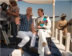  ??  ?? BELOW: Director Stephen Daldry with Matt Smith as Prince Philip.