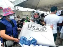  ?? ?? USAID distribute­d heavy-duty tarpaulins to meet the emer- gency shelter needs of 9,400 families after Typhoon Odette.